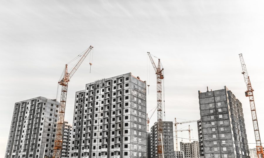 Construction cranes on an active building site